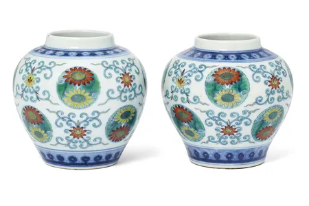 An associated pair of Chinese doucai &quot;lotus and chrysanthemum&quot; jars from the Qing Dynasty