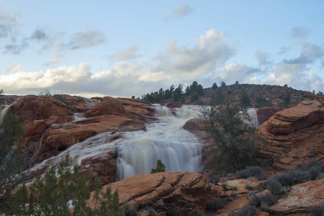 Waterfall on red rocks