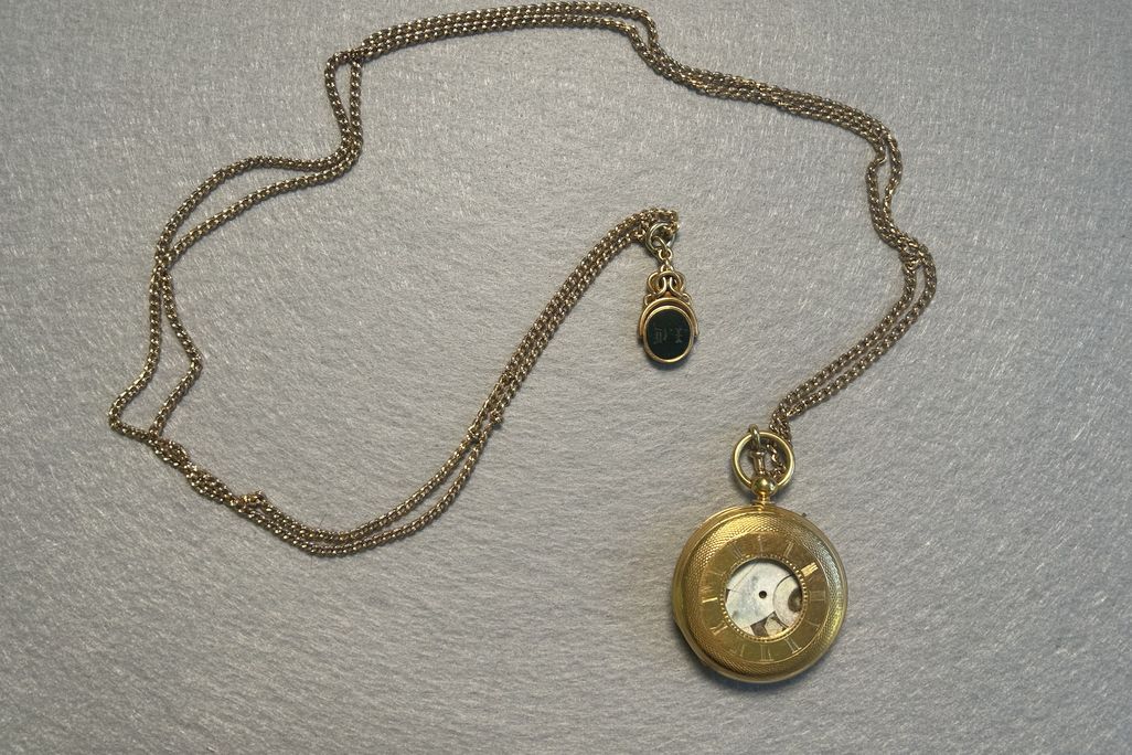 Gold pocket watch with chain