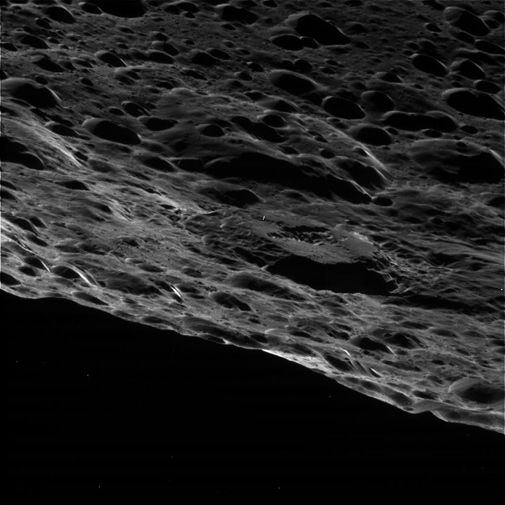 A close fly-by of Saturn's two-faced moon.