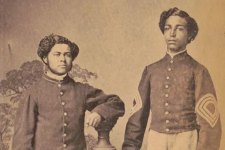Sergeant Major William L. Henderson and hospital steward Thomas H.S. Pennington of the 20th U.S. Colored Troops Infantry Regiment, as photographed by W.H. Leeson