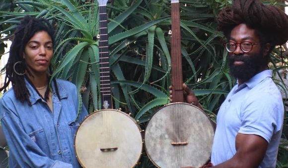 Black Banjo Reclamation Project founders Hannah Mayree and Carlton “Seemore Love” Dorsey, with banjos made by Brooks Masten of Brooks Banjos in Portland, Oregon. (Photo by Avé-Ameenah Long)