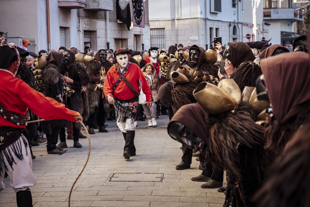 The Mamuthones form two lines and make way for the antics of the Issohadores.