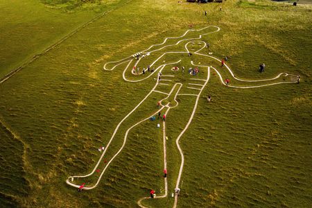 Volunteers repairing and refreshing the 180-foot-tall giant in 2019