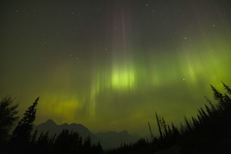 The northern lights as seen through a layer of wildfire smoke in Banff National Park in Alberta, Canada, in September 2022.