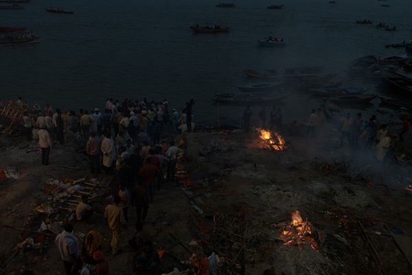 Burning ritual on the banks of the Ganges in Varanasi at night thumbnail