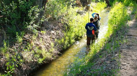 Drylands design students walking a ditch in the Embudo Valley