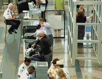 Right of Passage: In contrast to the early days of commercial airline travel, today, airport security officers screen passengers and their carry-on baggage in an effort to prevent attacks.