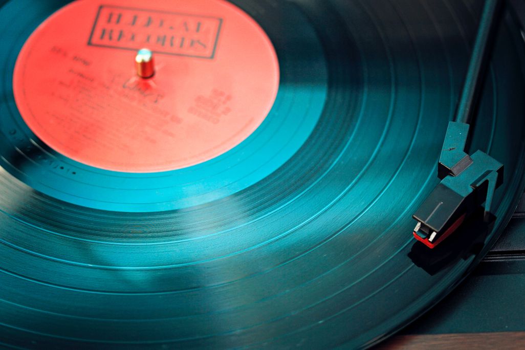 Close-up shot of vinyl record on record player