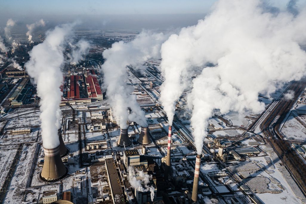 Smoke stacks of a coal fired power plant in China during winter