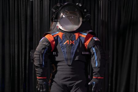 The new suits will actually be all white, but Axiom Space showed off its prototype with a dark gray cover material.