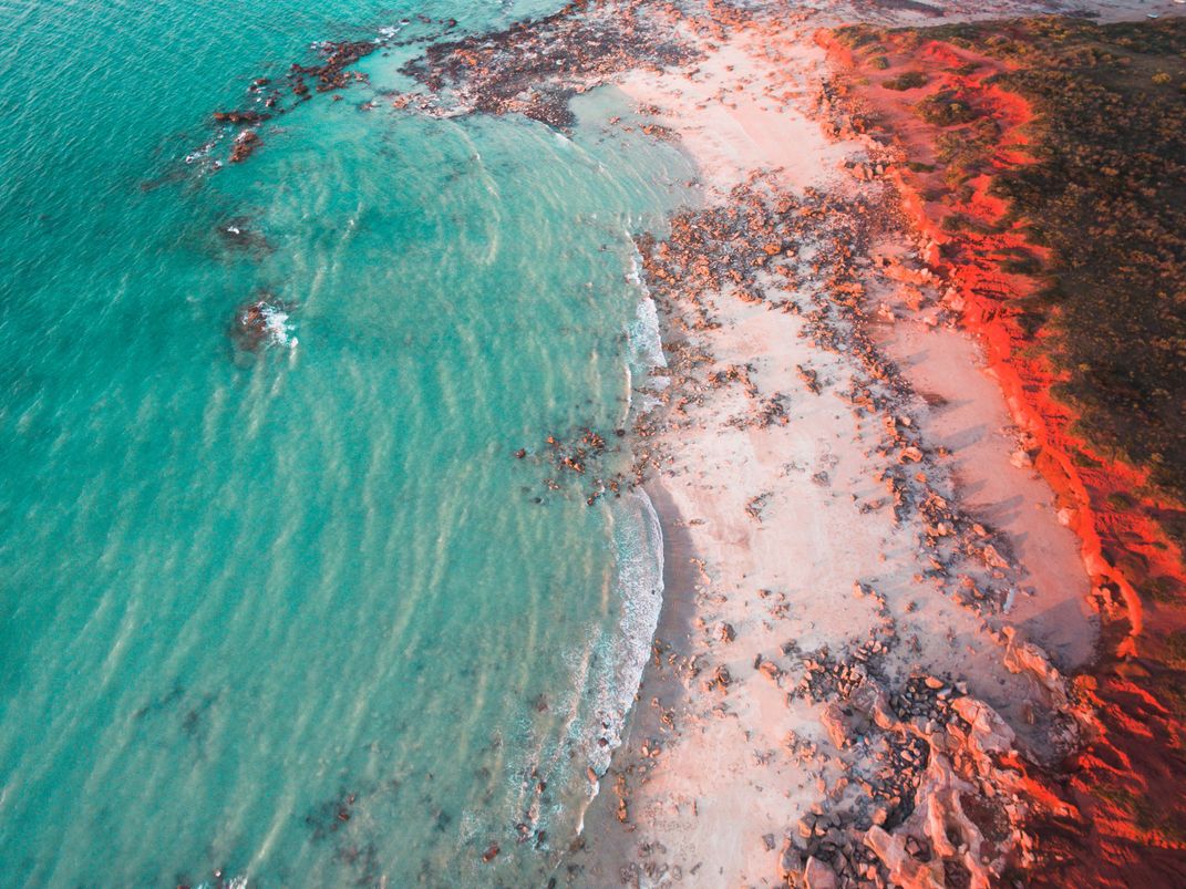 An aerial view of the crimson cliffs of Gantheaume Point near Broome
