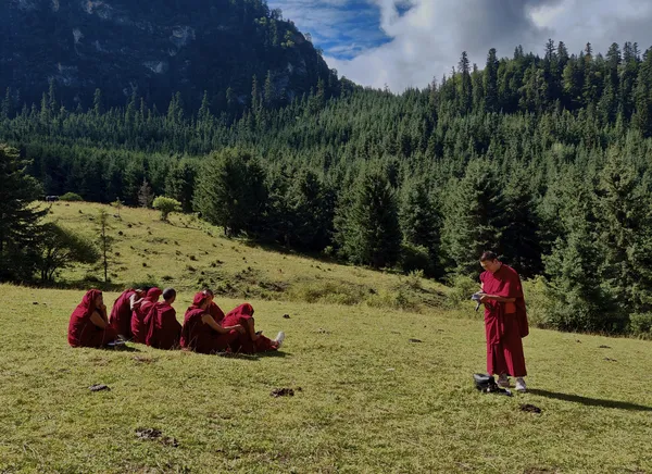 Monks in crimson robes thumbnail