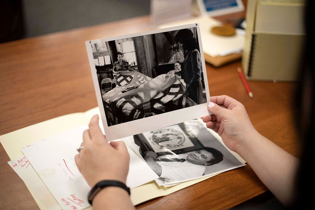 Woman holds photograph of Lumbee 