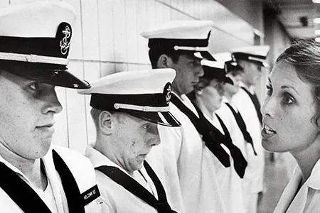Now serving grief: Irwin (right) gives Holcomb (left) a lesson on why no plebe should ever forget the menu.