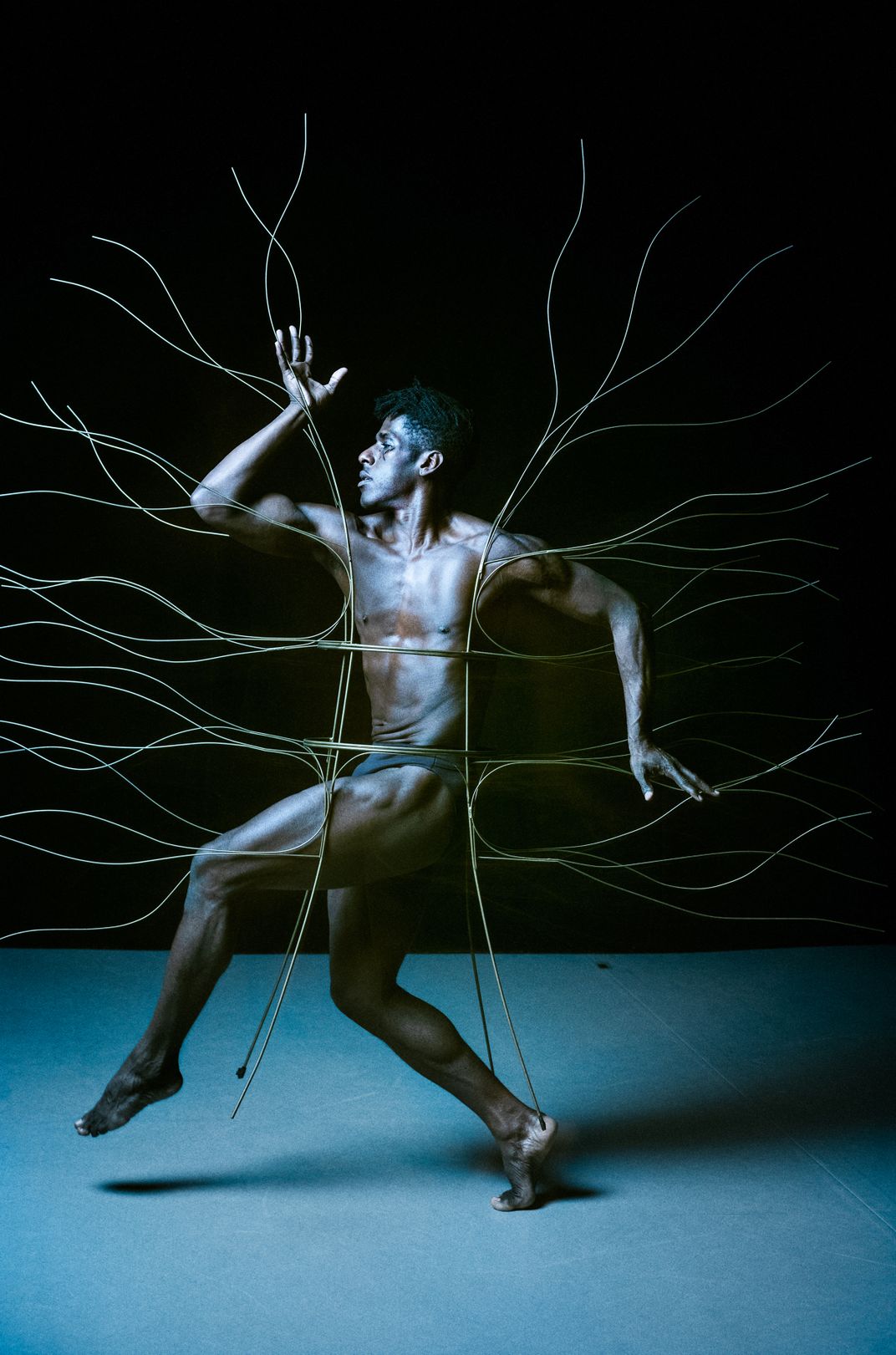 Lloyd Knight, principal dancer with Martha Graham Dance Company, wears Isamu Noguchi’’s brass Spider Dress from Cave of the Heart (1946) at the company’s studio in New York City’s West Village.