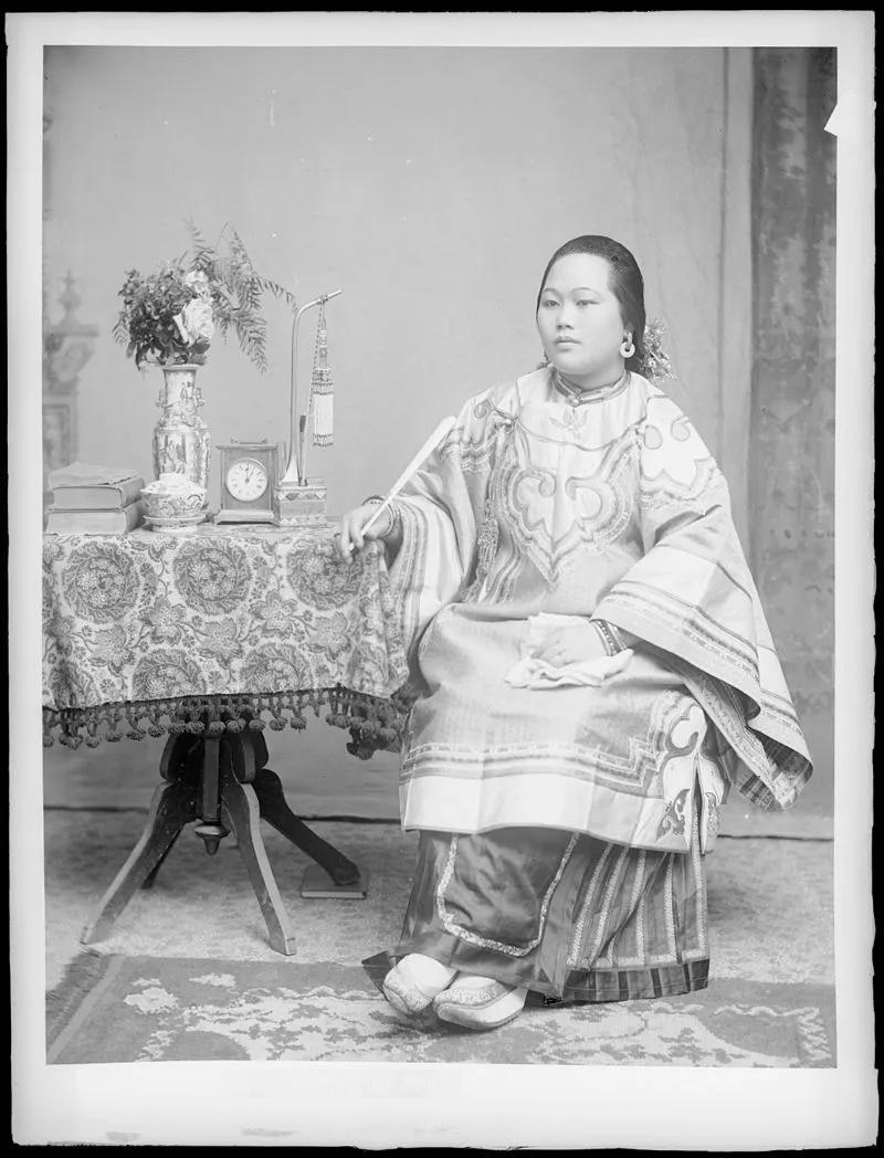 A young Chinese woman in traditional dress, circa 1920