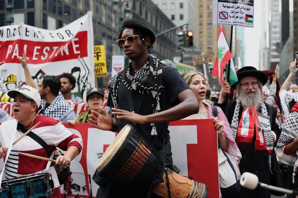 A protester bangs on a drum thumbnail