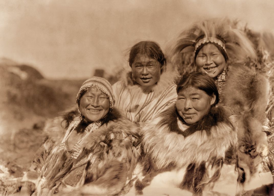 Four smiling Nunivak women
