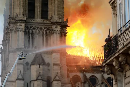 A firefighter is seen fighting the flames at Notre-Dame Cathedral on April 15, 2019
