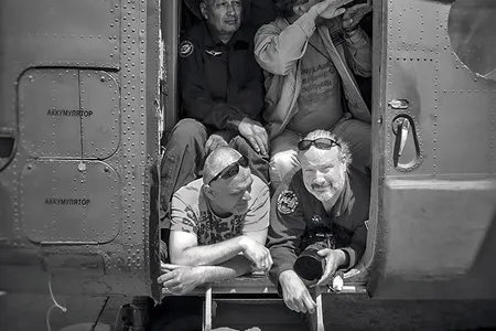 Bill Ingalls (bottom right) in a helicopter prior to taking off for an air-to-air shoot. His first gig was an internship at NASA as a writer and producer, doing TV work.