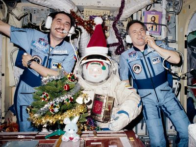 Christmas time on Mir, 1997, with cosmonauts Pavel Vinogradov (left) and Anatoly Solovyev. Russians are much more lax about drinking in space than Americans are, and alcohol isn't just for holidays.