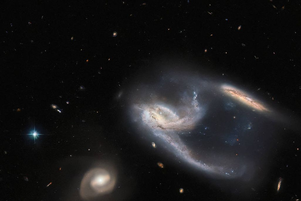 An image of three swirling galaxies taken by the Hubble Space Telescope