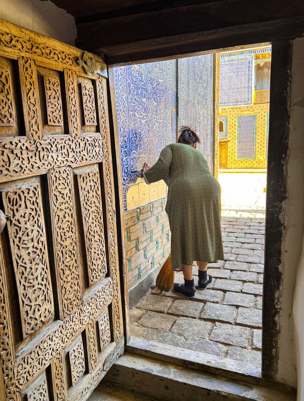 Elderly Woman Sweeping the Entranceway thumbnail