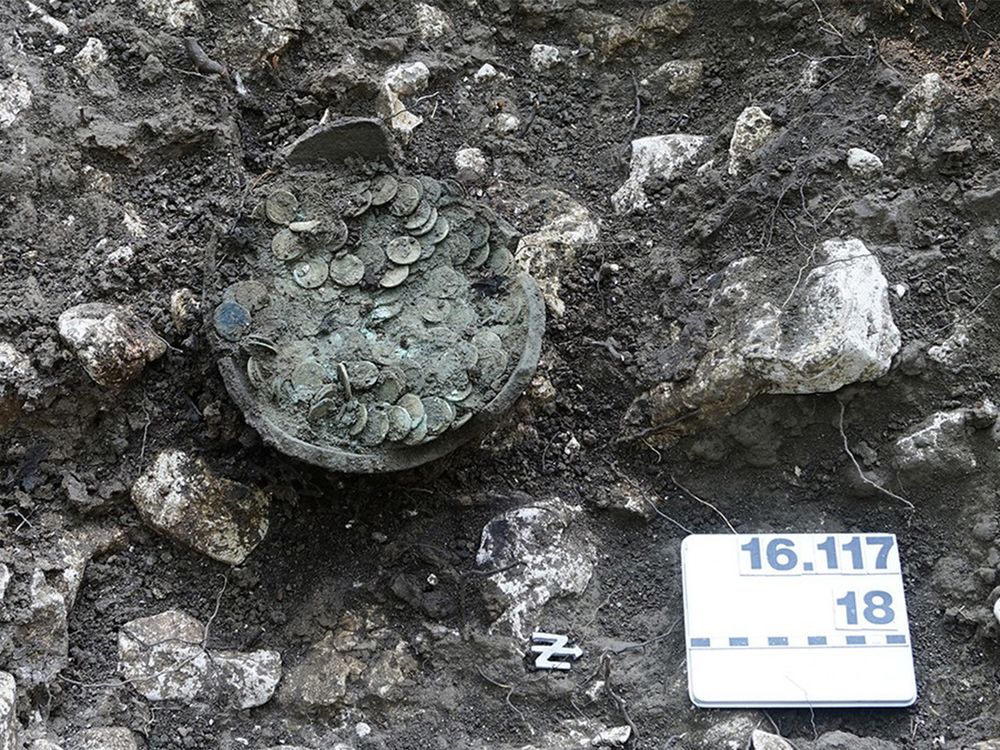 Coins in a clay pot