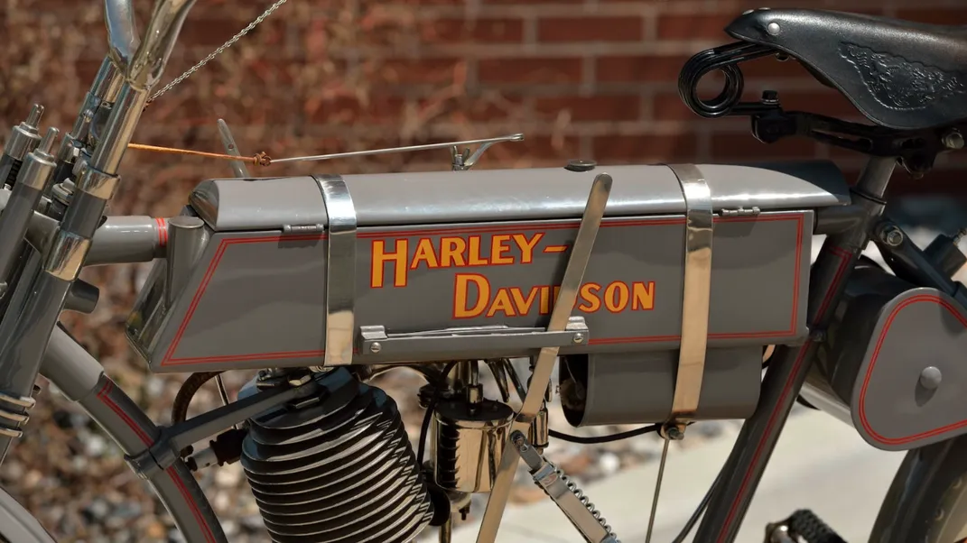 Close-up shot of orange Harley-Davidson logo