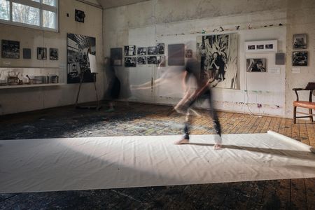 "The paint went all over, and of course some of it went off the canvas," the photographer says of Pollock's technique, re-enacted here in his studio. 