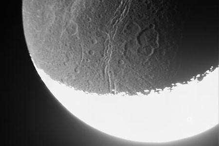 Cassini captures the dim light from a distant moon.