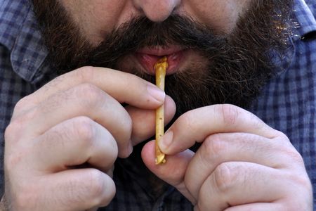 Researcher Laurent Davin plays a replica of one of the 12,000-year-old bird bone flutes recently discovered in northern Israel.