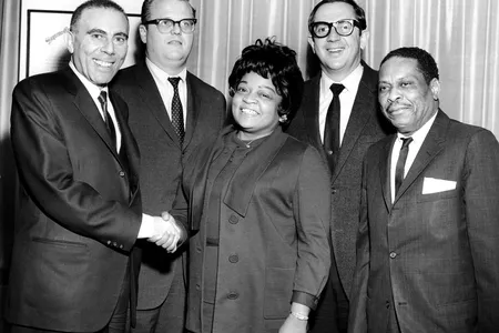 Vivian Carter (center) and her husband, Jimmy Bracken (far right), launched Vee Jay Records in 1953.
