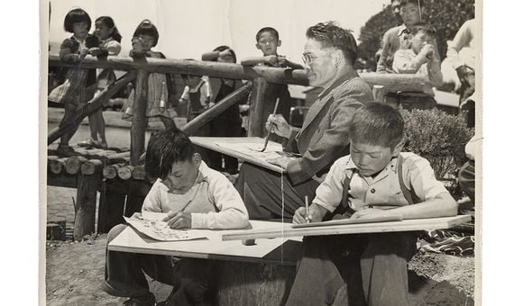 Photograph of Chiura Obata teaching a children's art class at Tanforan Art School, 1942 / unidentified photographer. Chiura Obata papers. Archives of American Art, Smithsonian Institution.