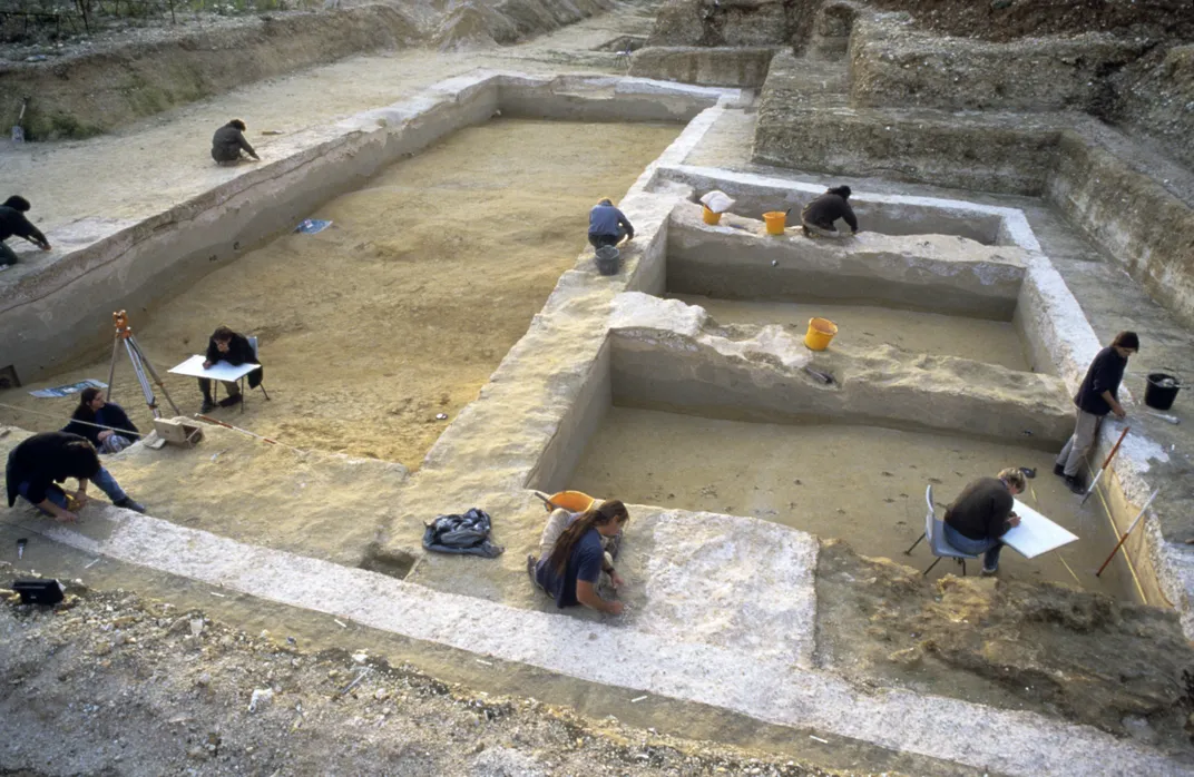 Overhead view of archaeologists working at a dig site