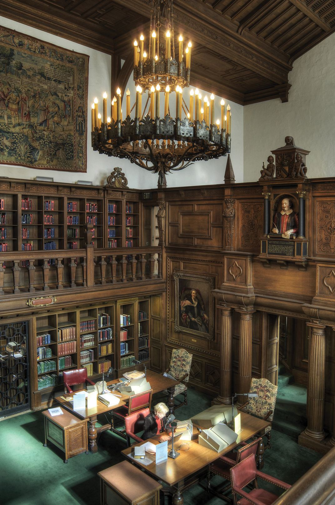 a person sits in a reading room in a library