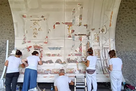 Archaeologists created a curved support structure that mimics the ceiling&rsquo;s original shape.