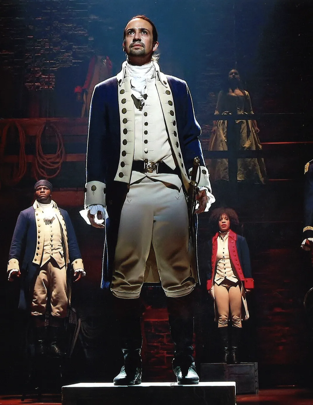 Man with brown hair wearing colonial clothing