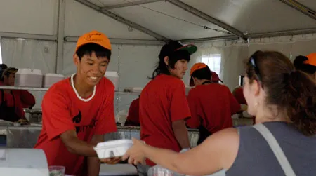 A visitor samples southeast Asian food at the 2011 Smithsonian Folklife Festival
