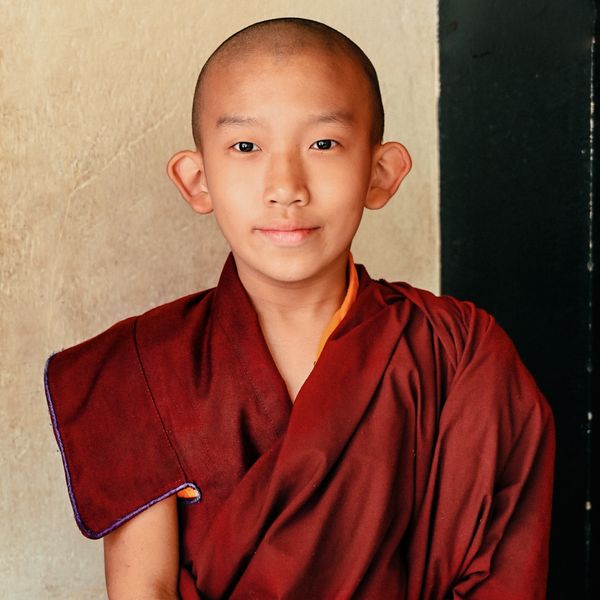 A trainee monk poses thumbnail