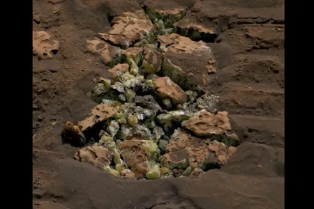 After Curiosity unexpectedly cracked open a Martian rock, it revealed yellow crystals that scientists determined were elemental sulfur.