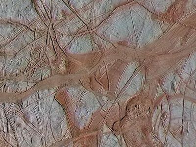 Underneath the cracked ice of Jupiter's moon Europa, there is likely a global ocean. Bluish ice in this Galileo spacecraft image is more pure water ice, while the reddish areas are ice mixed with other substances.