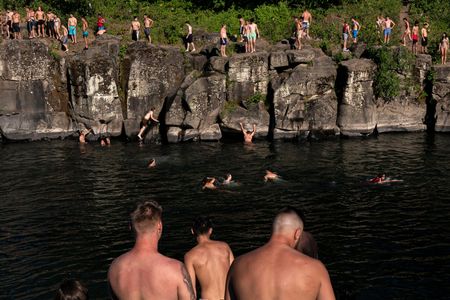 On June 27, residents flocked to the Clackamas River at High Rocks Park in Portland, Oregon, to take a dip and enjoying some cliff jumping.