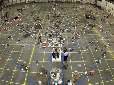 Debris from Columbia, arranged in place in a NASA hangar.