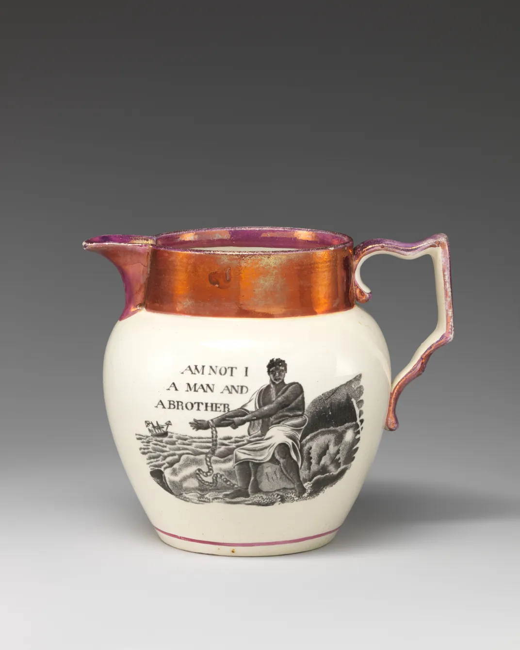 A white jug with pinky-orange copper trim, with a black engraving that depicts an enslaved kneeling man holding his outstretched bound wrists