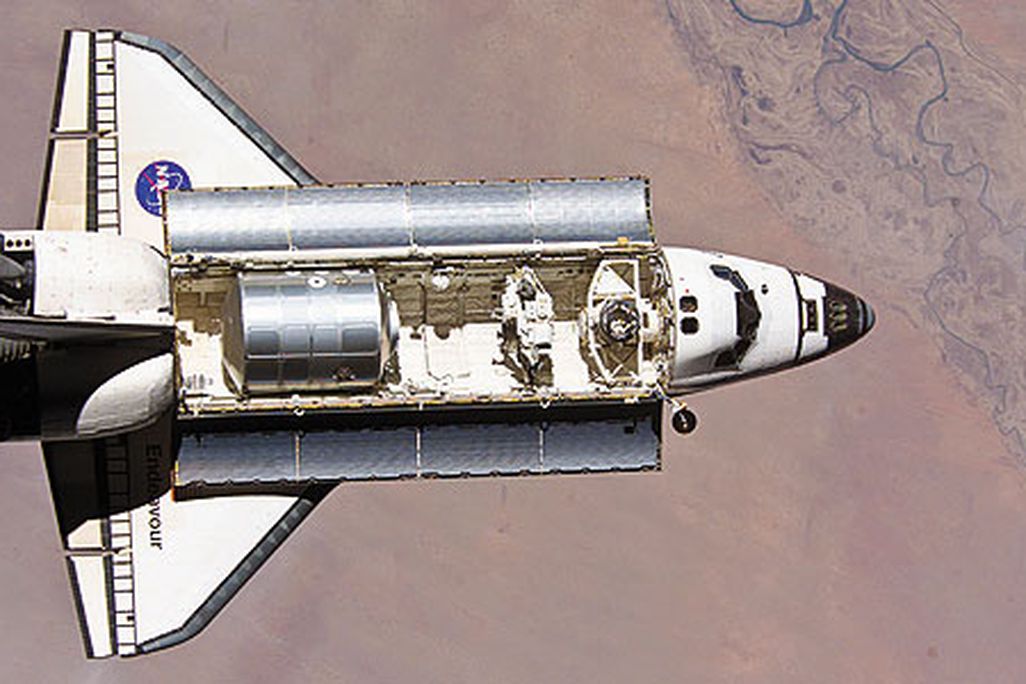 The shuttle main engine is the most tested large rocket engine in the world. In 1996, a turbine component (displayed here by a NASA scientist) underwent airflow tests to help engineers create more eff