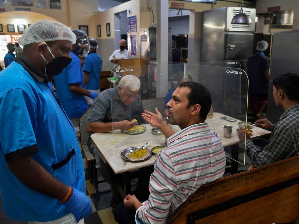 Man Talks in Restaurant During COVID-19 Pandemic