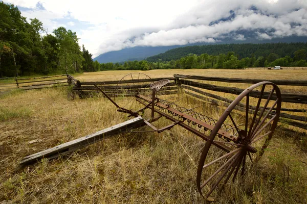 Antique horse drawn hay rake in British Columbia. thumbnail