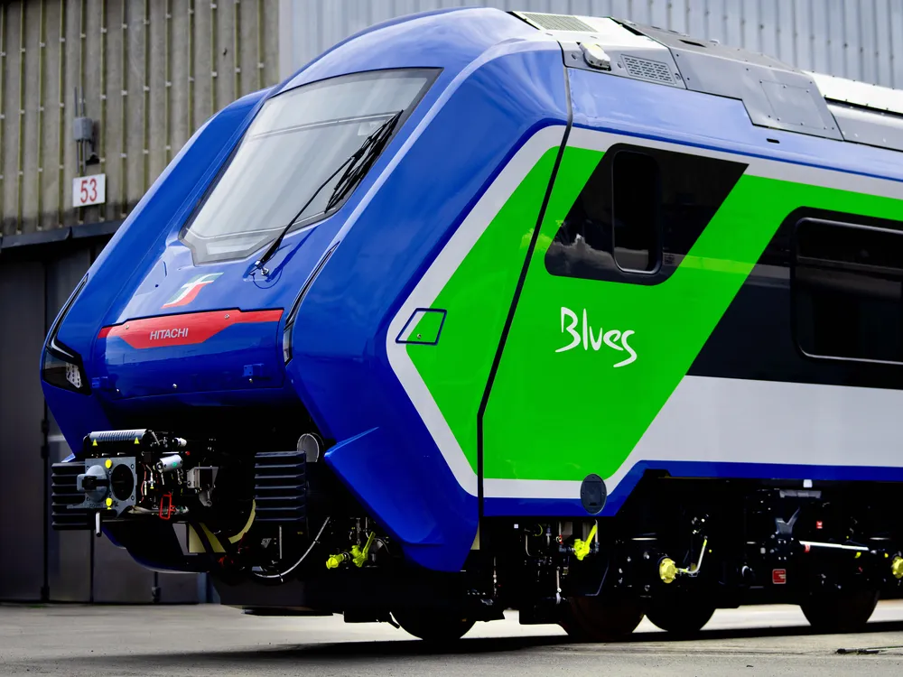 Blue train with green shape and white stripe